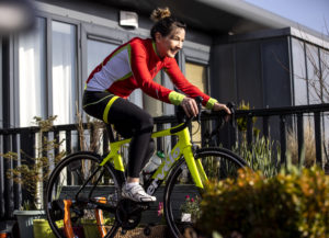 Women on a Turbo Trainer in her garden