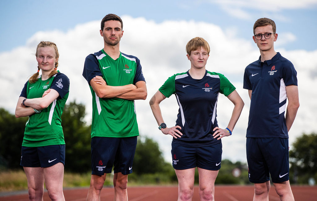Judith MacCombe, James Edgar, Chloe MacCombe and Oliver Gunning stand in a row wearing their Commonwealth Games training kit.