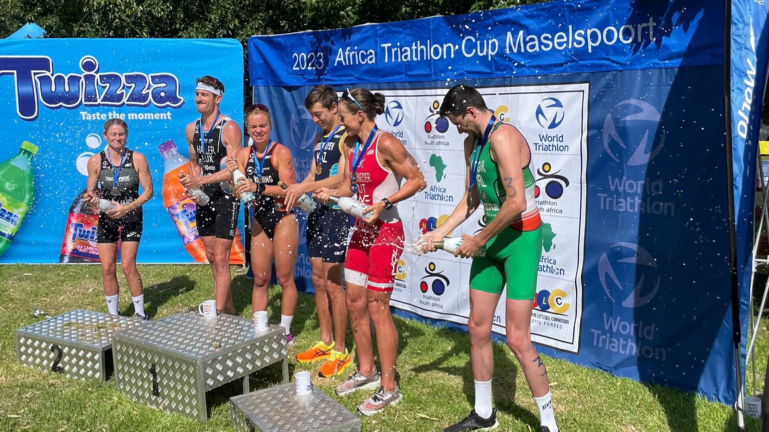 James Edgar celebrates with the other podium athletes after Africa Triathlon Cup Maselspoort.