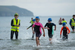 Children coming out of sea at triathlon