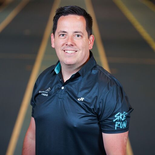Triathlon Ireland CEO Darren Coombes standing in front of race track
