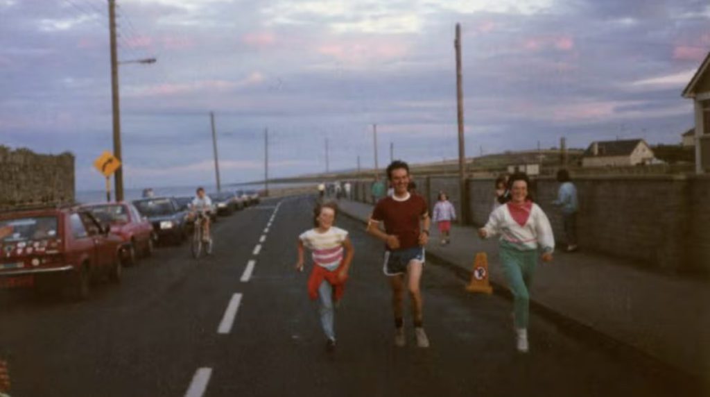Maurice Mullins running with his family