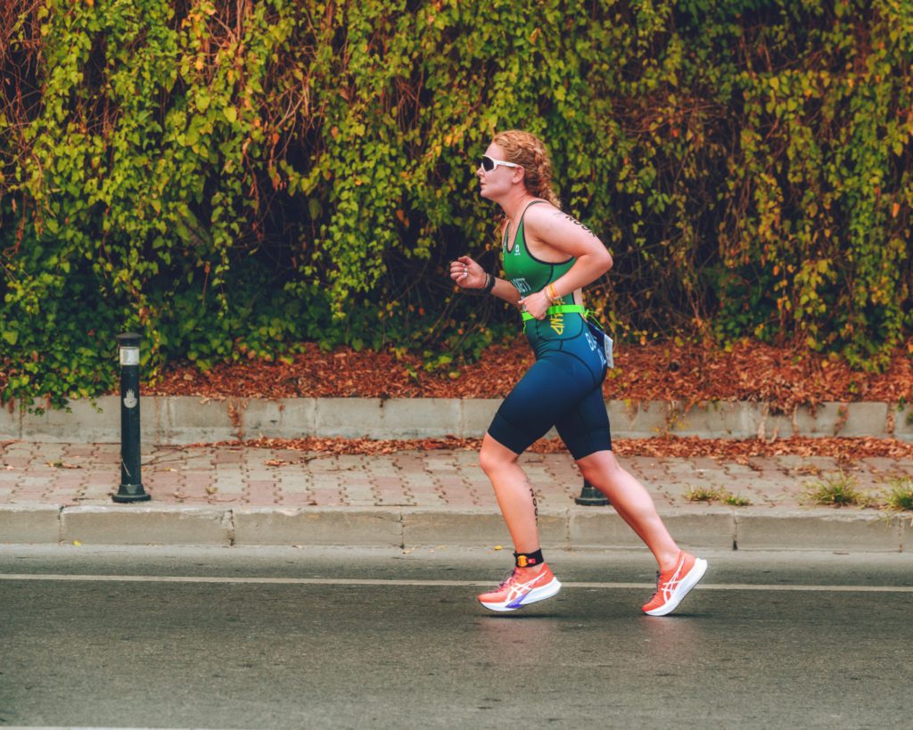 Tri Team Ireland female triathlete racing on road