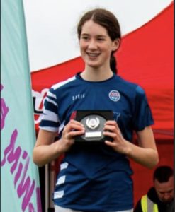 Youth Triathlon Commission Members 2026 - girl in Blue Top medal