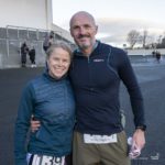 man and woman at start of race