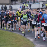 Runners starting at duathlon leading the pack in blue tri suit