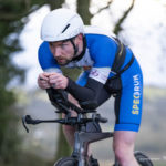 Cyclist in low profile on bike