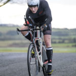 Cyclist going up hill at duathlon
