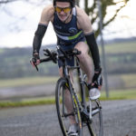 Cyclist going up hill at duathlon
