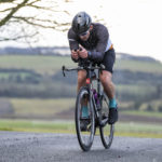 Cyclist going up hill at duathlon