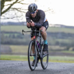 Cyclist going up hill at duathlon
