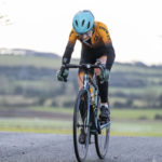 woman Cyclist going up hill at duathlon