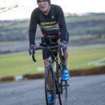 Cyclist going up hill at duathlon