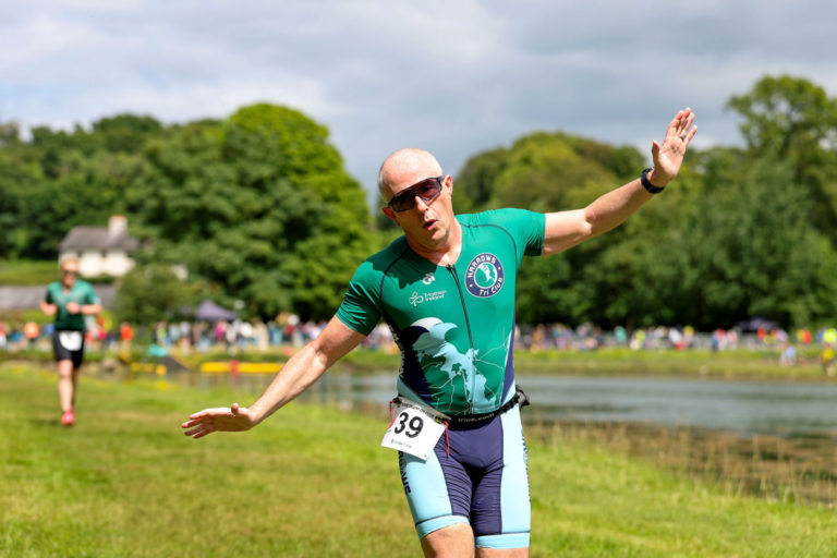 happy runner Beyond the Wall Triathlon 2026