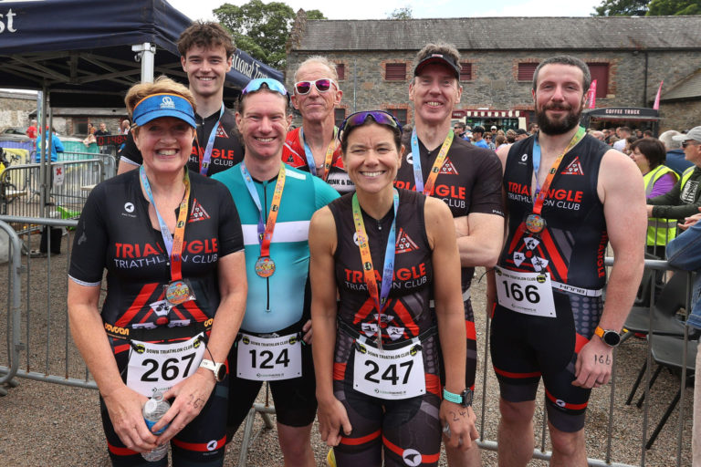 team celebrating Beyond the Wall Triathlon 2026