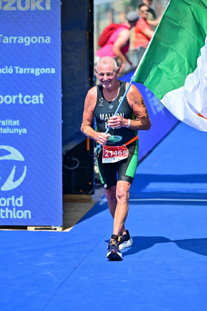 Tri-Team Ireland Mallon Athlete holding flag