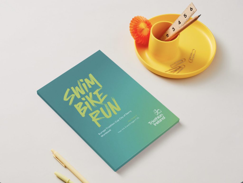 Triathlon Ireland schools workbook at desk