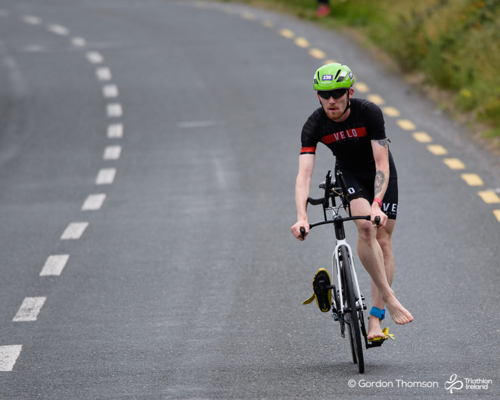 Darren Dunne dismounts his bike at Loughrea Triathlon